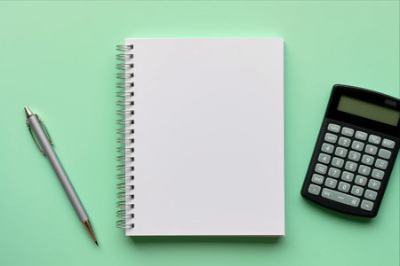 Organizational Essentials: Notepad, Green Folder Calculator - Mockup on Office Background for Copy Spaceの素材