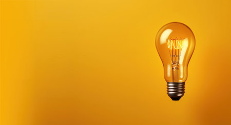 Light bulb on a yellow background. Idea, inspiration. Symbol of creativity, mind, thinking, successの素材