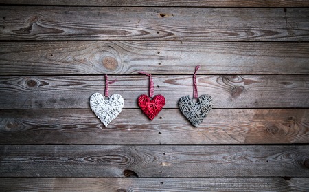 Love hearts on wooden texture background, valentines day card conceptの写真素材