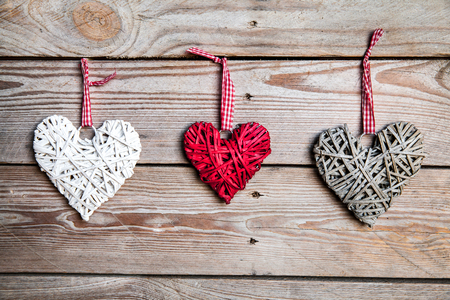 Love hearts on wooden texture background, valentines day card conceptの写真素材