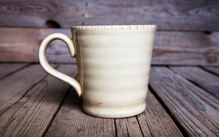 Cup of coffee on wooden backgroundの写真素材