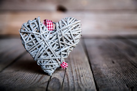 Gray heart on a wooden background. Red, Valentine's Day, Day of the enamoredの写真素材