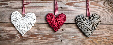 Love hearts on wooden texture background, valentines day card conceptの写真素材