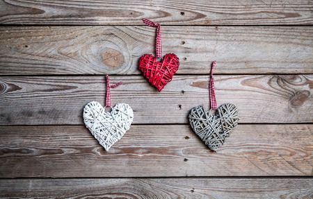 Love hearts on wooden texture background, valentines day card conceptの写真素材