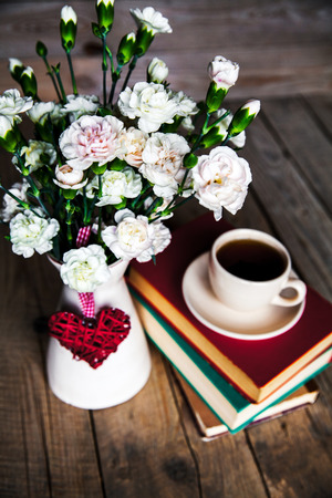 Coffee, books and flowersの写真素材