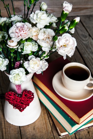 Coffee, books and flowersの写真素材