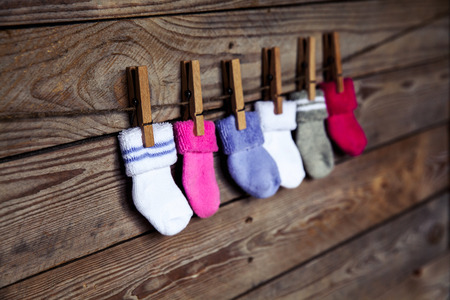 knitted  socks on a wooden backgroundの写真素材