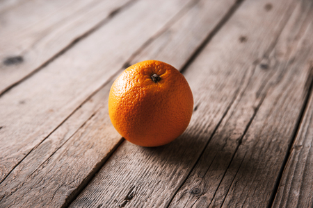 fresh, orange on  a wooden backgroundの写真素材