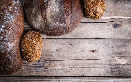 food. composition of bread with blank place for text on wooden background