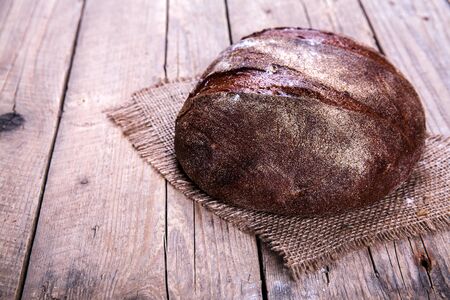 food, nice rye bread on a wooden background