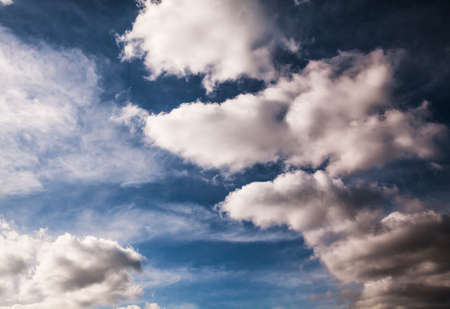 Blue sky with clouds and sun.の写真素材