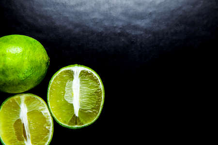 lime isolated on black with reflectionの写真素材