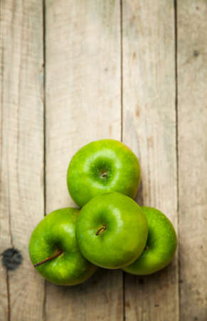 green apples on wooden backgroundの写真素材