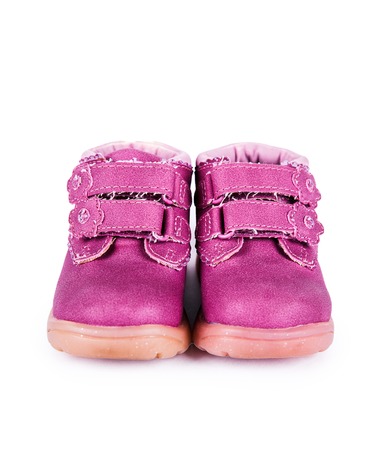 pink child boots white isolatedの写真素材
