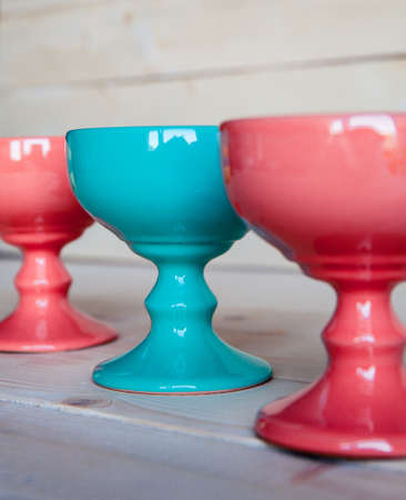 ice-cream bowls in red and blue on a wooden backgroundの写真素材