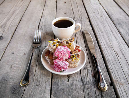 Turkish Delight, a cup of coffee with a fork and knifeの写真素材