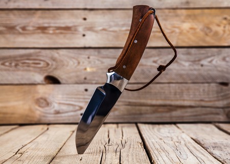 Knife on wooden table with copy spaceの写真素材