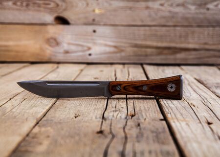 Knife on wooden table with copy spaceの写真素材