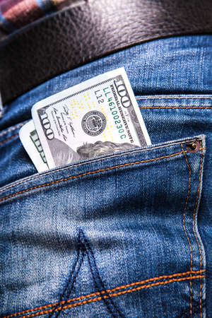 dollars in a jeans pocket, closeup