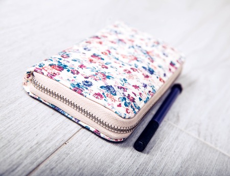 Evening Purse with flowers and black brushの写真素材