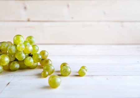 Grapes on a wooden tableの写真素材