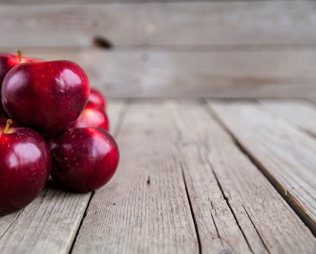 ripe apples on wooden tableの写真素材