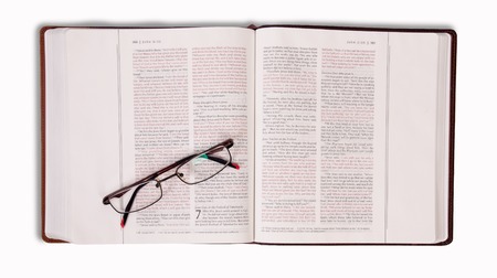 book pages with silver on a white background
