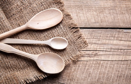 wooden spoon on wooden backgroundの写真素材
