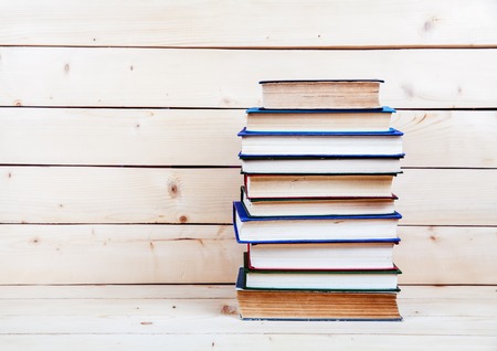 Old books on a wooden shelf.の写真素材