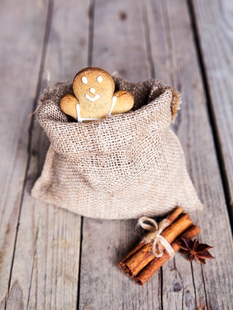 Christmas homemade gingerbread cookies on wooden tableの写真素材