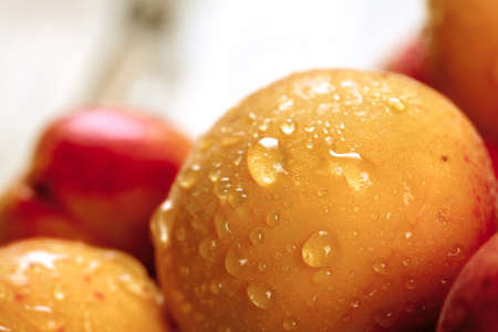 Apricot. Organic fruits with leaf on wooden backgroundの写真素材