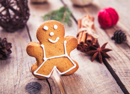Christmas tree background with Christmas tree and gingerbread shaped cookies. selective focus