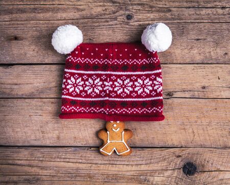 Christmas homemade gingerbread man on wooden table