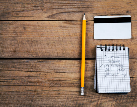 note and pencil, a shopping list for the holidays, credit cardの写真素材