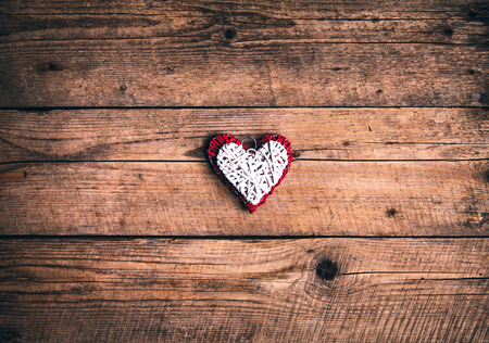 Heart on a wooden background. Vintage style.