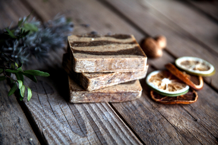 Organic scrub soap on wooden background.の写真素材