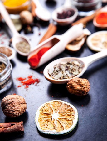 Spices on black background in special jars. Foodの写真素材