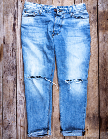 Jeans on a wooden backgroundの写真素材