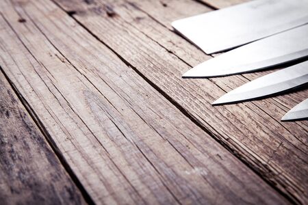 Beautiful knives with wooden handle, on an old table. Kitchen, cooking, cuttingの写真素材
