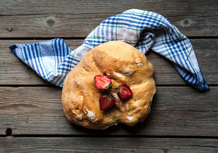 delicious breakfast with strawberries and bread on wooden background.の写真素材