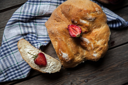 delicious breakfast with strawberries and bread on wooden background.の写真素材