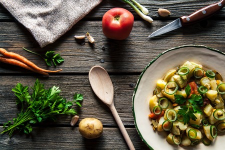 Vegetable stew on a wooden background. The rustic style.の写真素材