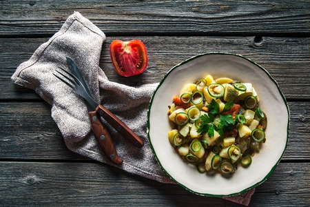Tasty food. Vegetable stew on a wooden background. The rustic style.の写真素材