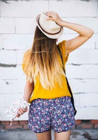 Portrait of beautiful girl in hat outdoors, fashion, style, retro clothingの写真素材