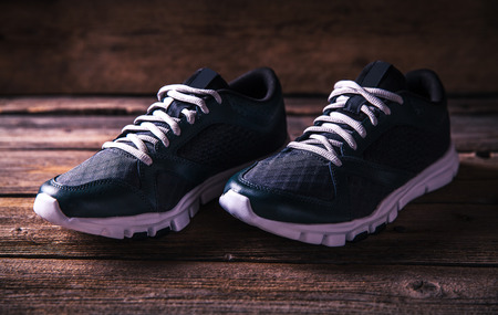 running shoes on a wooden background. sportの写真素材