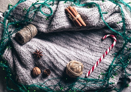 Gray sweater and Gerland with Christmas decorations. Celebrationの写真素材