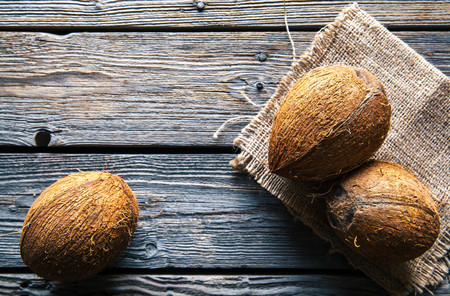 Coconuts on a wooden background, food, natureの写真素材