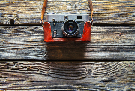Retro camera on wood tableの写真素材