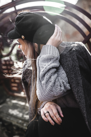 Street style portrait of young woman wearing colorful knitted clothes on the street.の写真素材