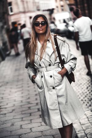 Outdoor fashion portrait of young beautiful stylish womanの写真素材